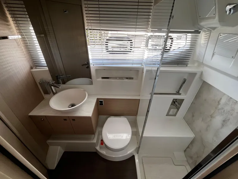 Slide: The Image of 2024 Jeanneau DB/43 OB boat bathroom with modern fixtures and compact design. - 28