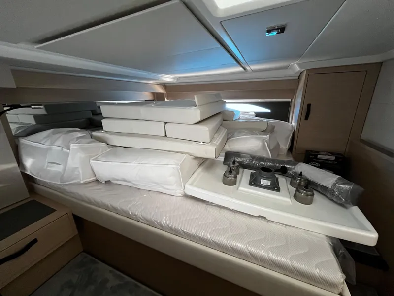Slide: The Image of Interior cabin of 2024 Jeanneau DB/43 OB with cushions and equipment. - 29