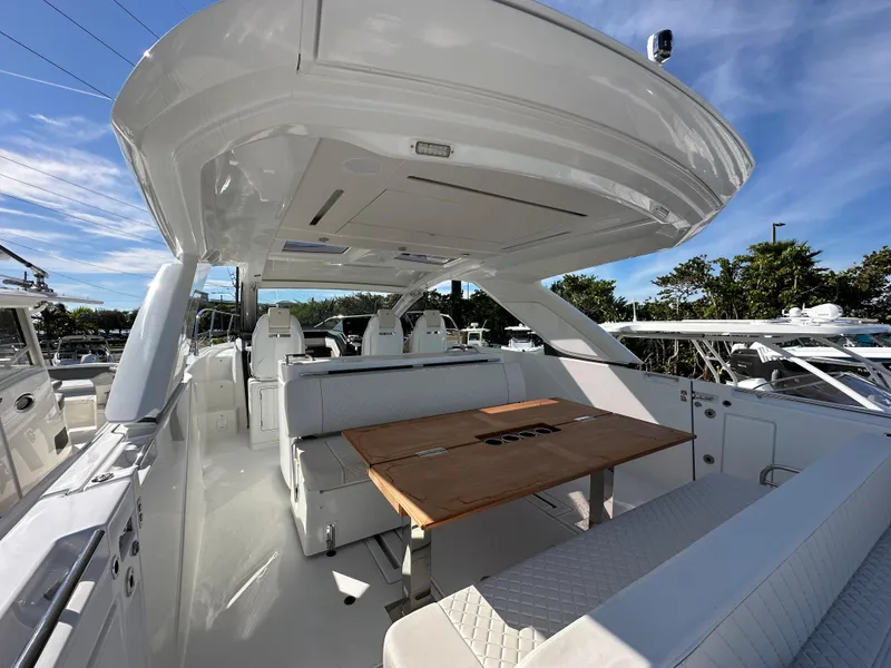 Slide: The Image of 2024 Jeanneau DB/43 OB luxury boat interior with seating and dining area. - 6