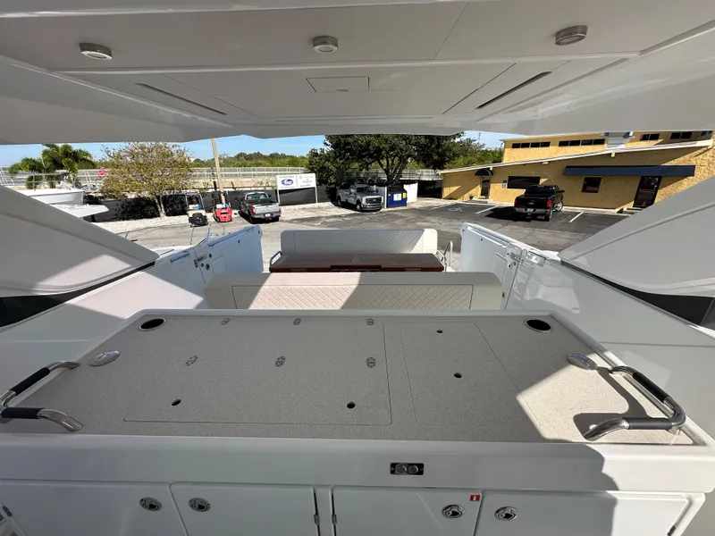 Slide: The Image of 2024 Jeanneau DB/43 OB boat interior with open deck and seating area. - 9