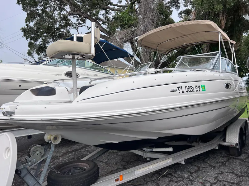 Slide: The Image of 2005 Starcraft Aurora 2210 I/O boat on trailer with canopy. - 1