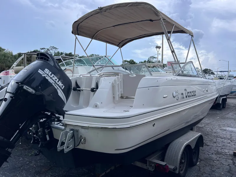 Slide: The Image of 2005 Starcraft Aurora 2210 I/O boat with Suzuki outboard motor on trailer. - 2