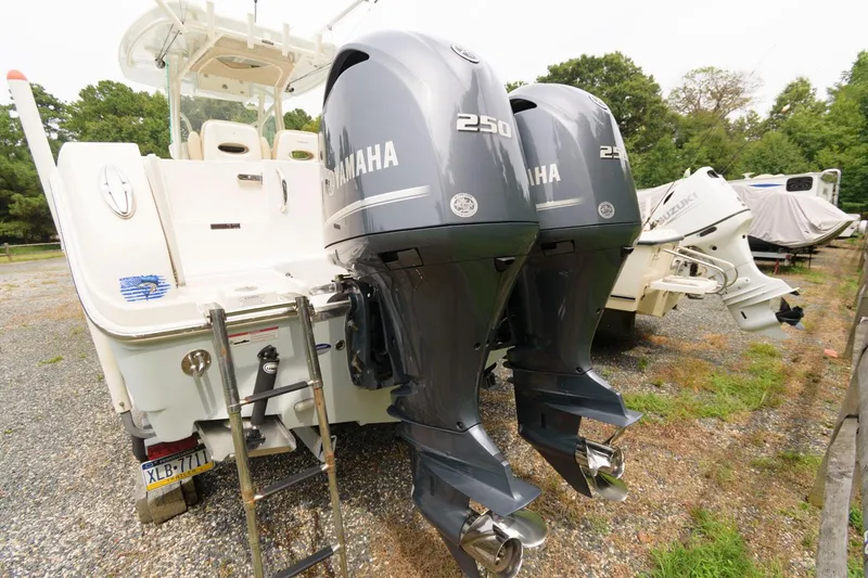 Slide: The Image of 2018 Sailfish 290 CC boat with twin Yamaha 250 outboard engines. - 19