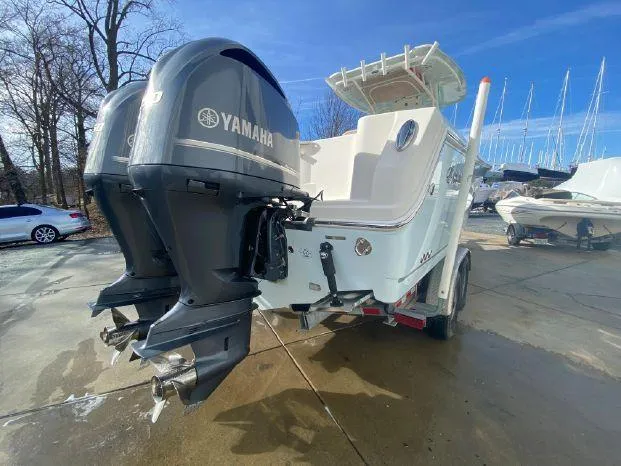 Slide: The Image of 2018 Sailfish 290 CC boat with twin Yamaha outboard engines. - 6