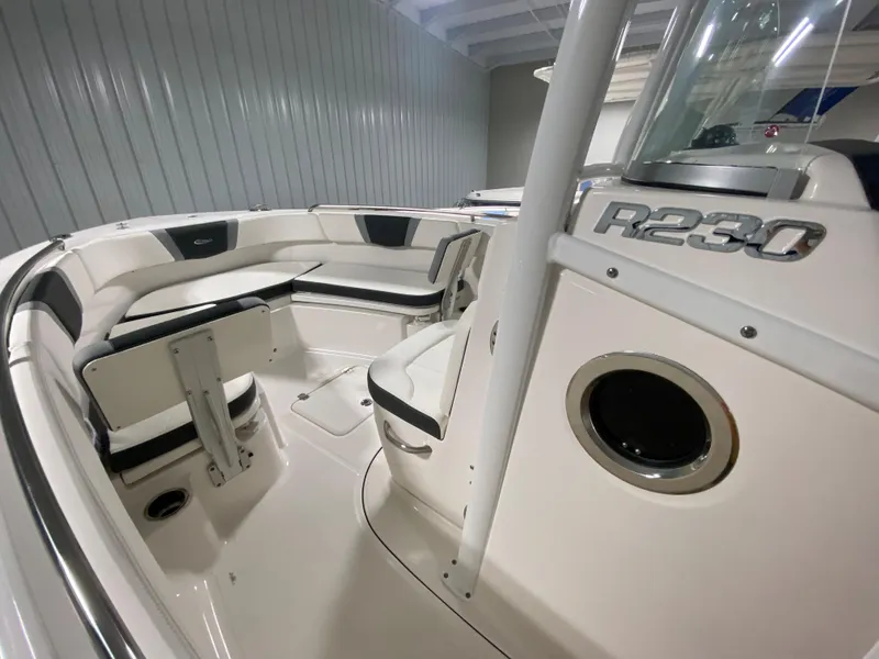 Slide: The Image of 2024 Robalo R230 Center Console boat interior with seating and console details. - 14
