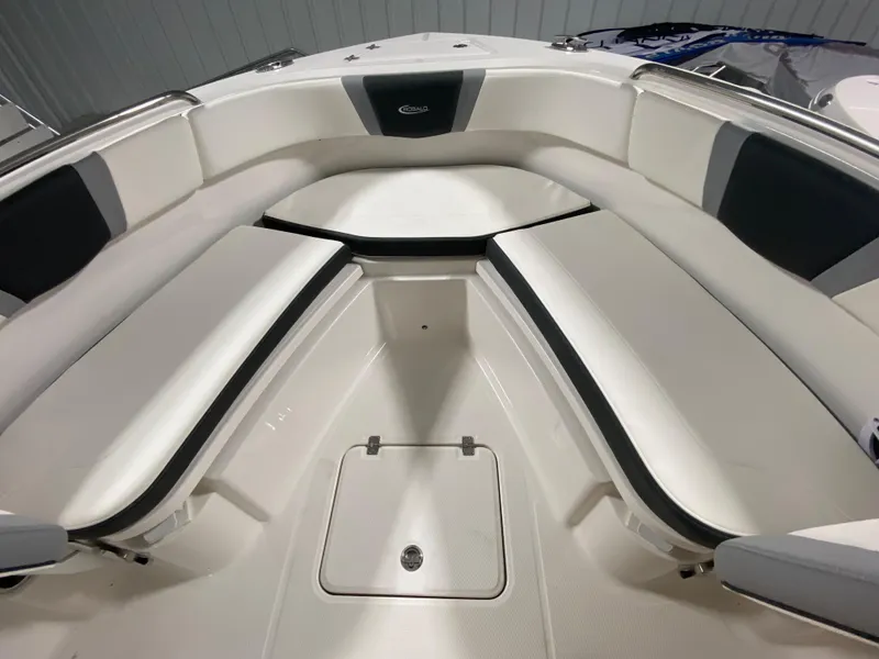 Slide: The Image of 2024 Robalo R230 Center Console boat interior with cushioned seating. - 17