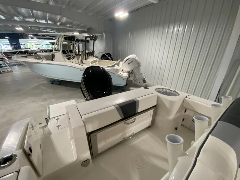 Slide: The Image of 2024 Robalo R230 Center Console boat interior in showroom. - 4