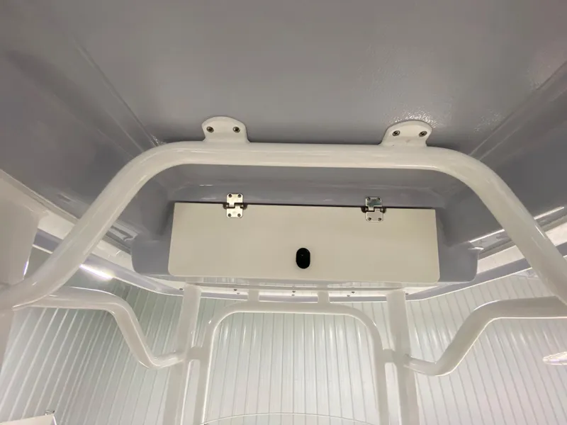 Slide: The Image of 2024 Robalo R230 Center Console T-top frame and storage compartment. - 12