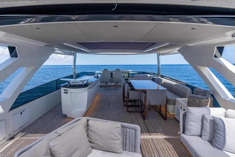 Slide: The Image of Luxurious 2022 Absolute Navetta 73 yacht deck with elegant seating and ocean view. - 17