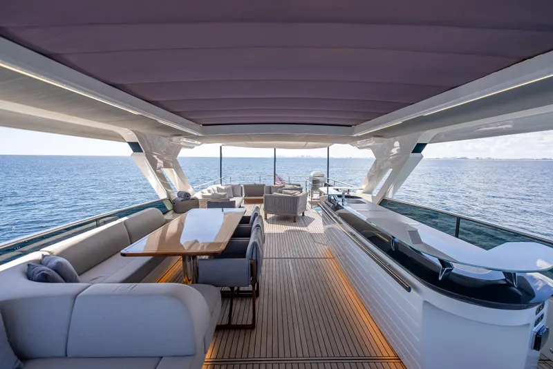 Slide: The Image of Luxurious 2022 Absolute Navetta 73 yacht interior with elegant seating and ocean view. - 18
