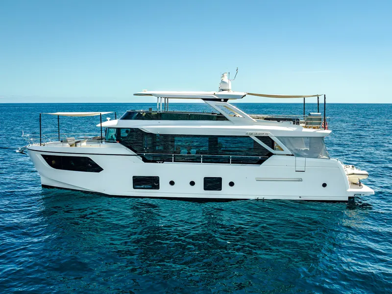 Slide: The Image of Luxury Absolute Navetta 73 yacht cruising on open sea, 2022 model. - 2