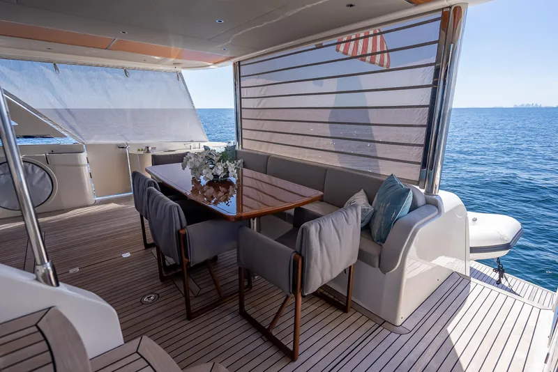 Slide: The Image of Luxury dining area on 2022 Absolute Navetta 73 yacht with ocean view. - 22