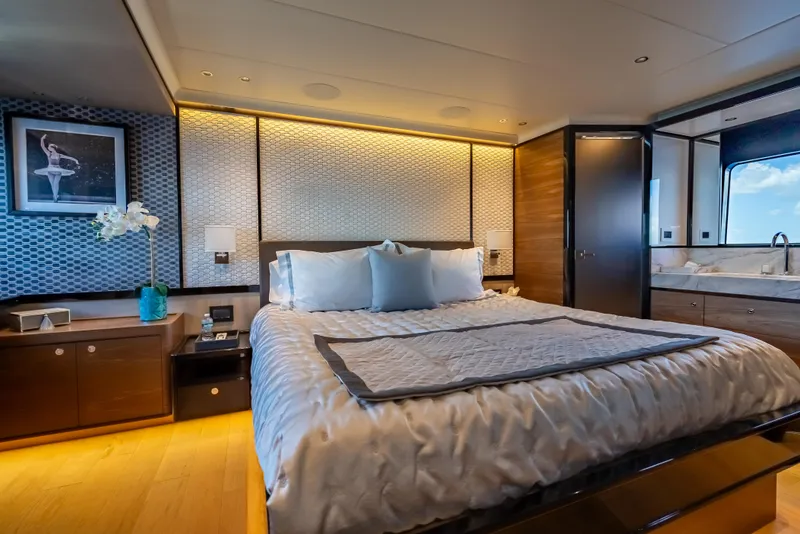 Slide: The Image of Luxurious bedroom interior on 2022 Absolute Navetta 73 yacht, featuring elegant decor and modern amenities. - 31