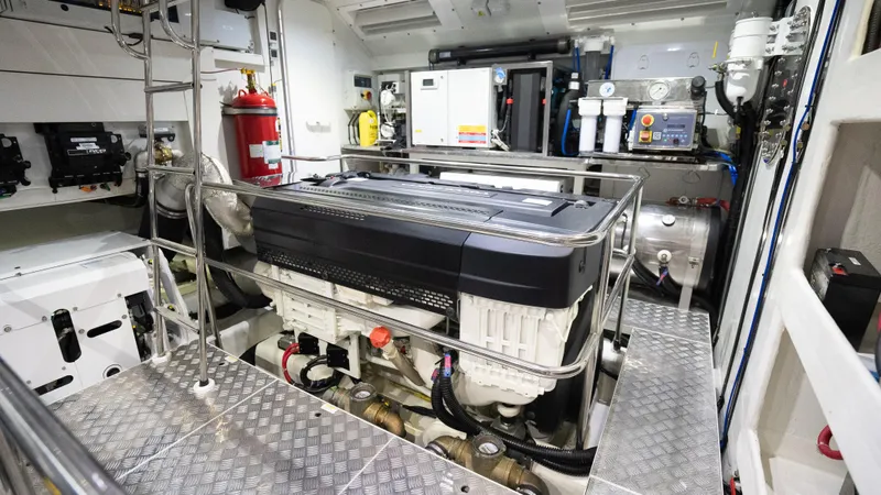 Slide: The Image of Engine room of 2022 Absolute Navetta 73 yacht, featuring advanced machinery and equipment. - 37