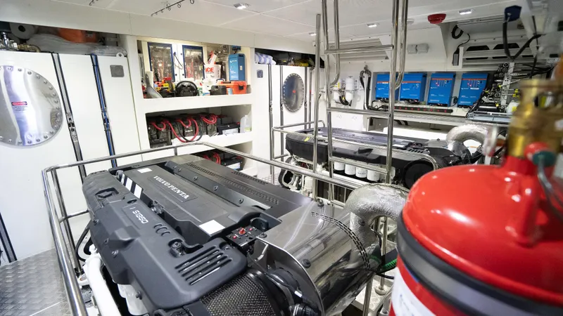 Slide: The Image of Engine room of 2022 Absolute Navetta 73 yacht, featuring advanced machinery and equipment. - 38