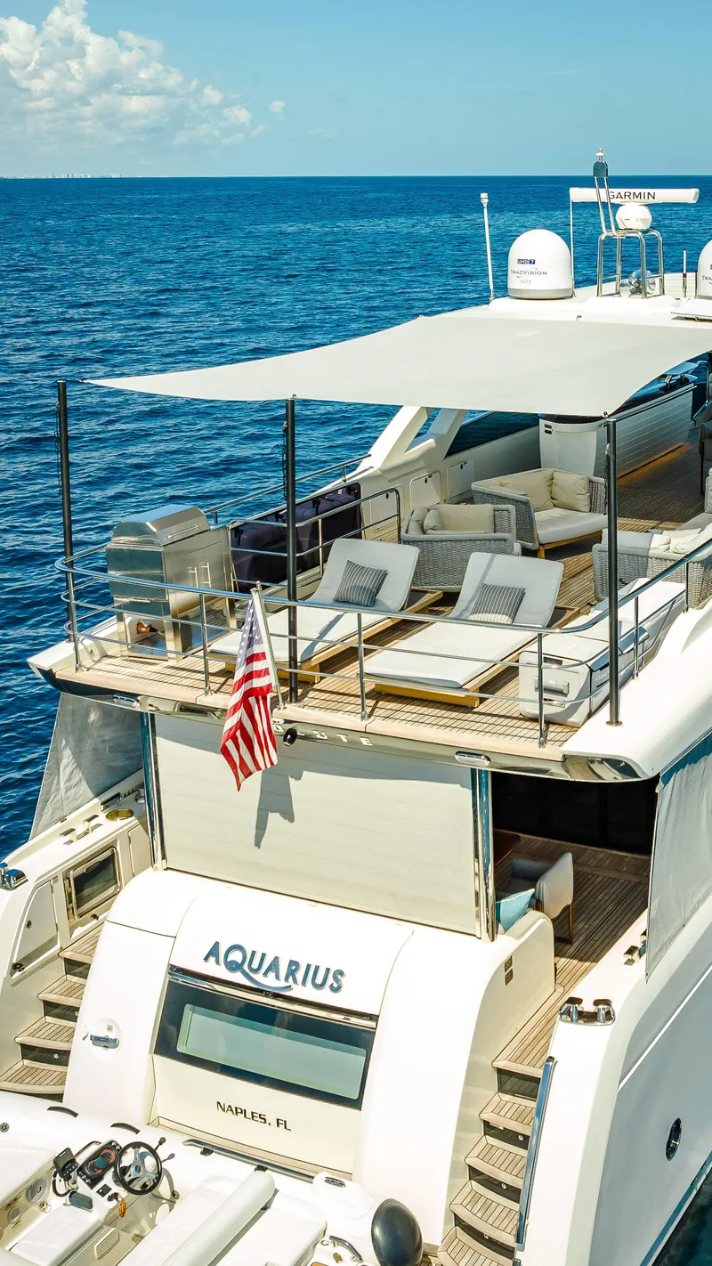 Slide: The Image of Luxurious 2022 Absolute Navetta 73 yacht with sun deck, cruising in clear blue ocean. - 6