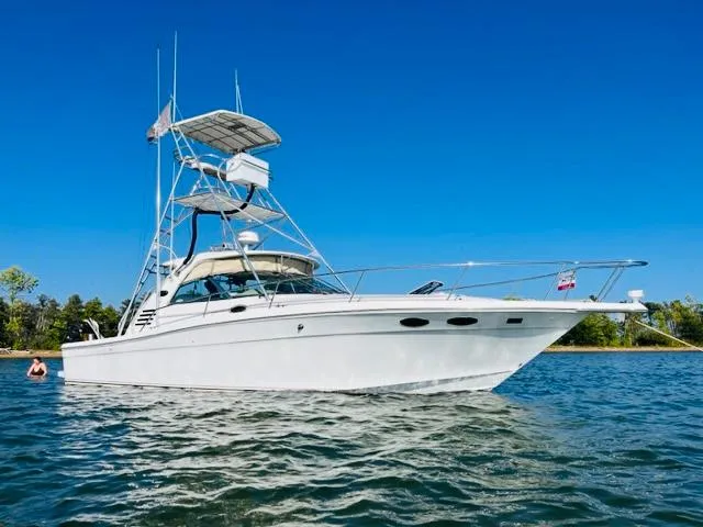 The Image of 1998 Sea Ray Express Cruiser on water under clear blue sky. - 0