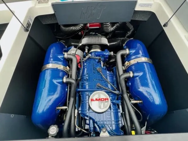 Slide: The Image of 2023 MasterCraft NXT22 engine with blue Ilmor components. - 18