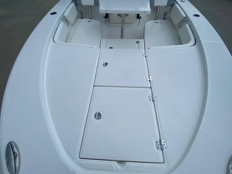 Slide: The Image of 2024 Robalo 246 Cayman boat deck with storage compartments. - 25