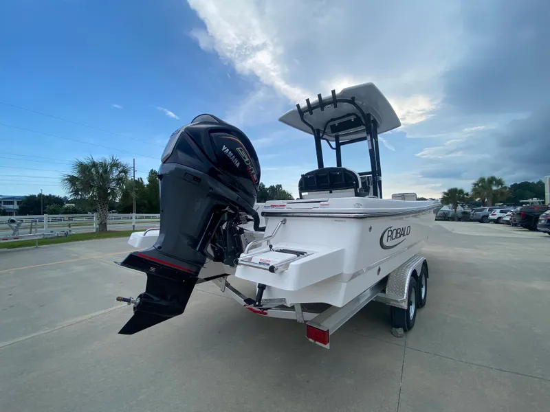 Slide: The Image of 2024 Robalo 246 Cayman boat on trailer with outboard motor. - 3