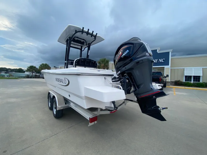Slide: The Image of 2024 Robalo 246 Cayman boat with Yamaha outboard motor on trailer. - 4
