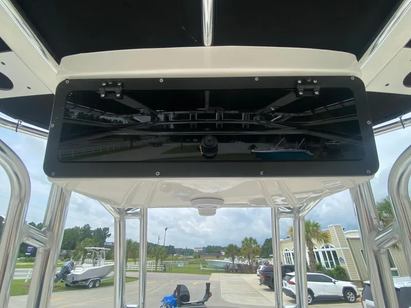 Slide: The Image of 2024 Key West 210 Bay Reef boat console with overhead storage. - 12