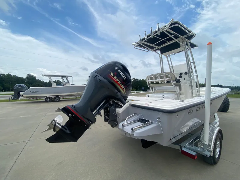 Slide: The Image of 2024 Key West 210 Bay Reef boat with Yamaha outboard motor on trailer. - 2