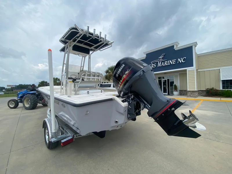 Slide: The Image of 2024 Key West 210 Bay Reef boat with Yamaha outboard motor at a dealership. - 3