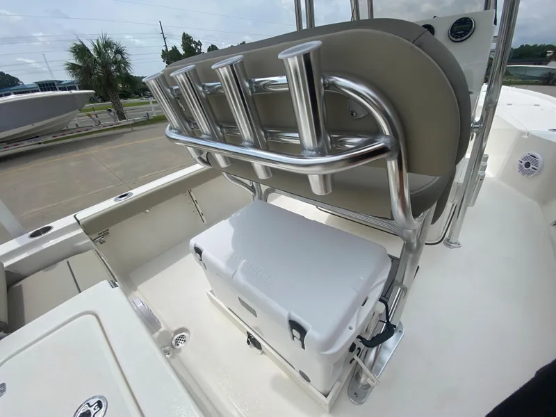 Slide: The Image of 2024 Key West 210 Bay Reef boat interior with rod holders and cooler. - 9
