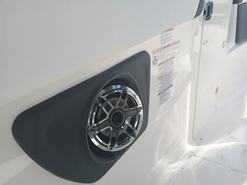 Slide: The Image of 2024 Chaparral 280 OSX boat speaker detail on white exterior. - 13