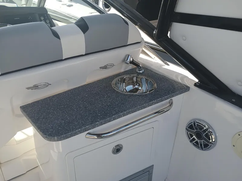 Slide: The Image of 2024 Chaparral 280 OSX boat interior with sink and countertop. - 20