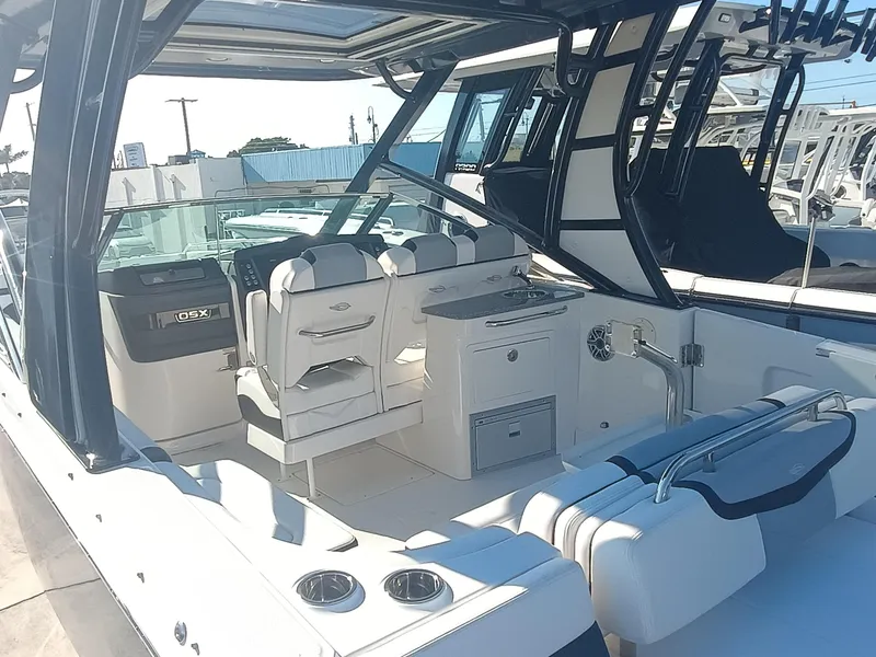 Slide: The Image of 2024 Chaparral 280 OSX boat interior with seating and helm station. - 25