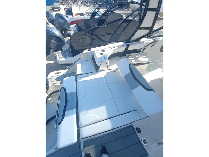 Slide: The Image of 2024 Chaparral 280 OSX boat interior with sleek seating and modern design. - 28