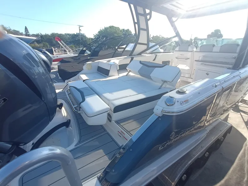 Slide: The Image of 2024 Chaparral 280 OSX boat with sleek seating and modern design. - 29