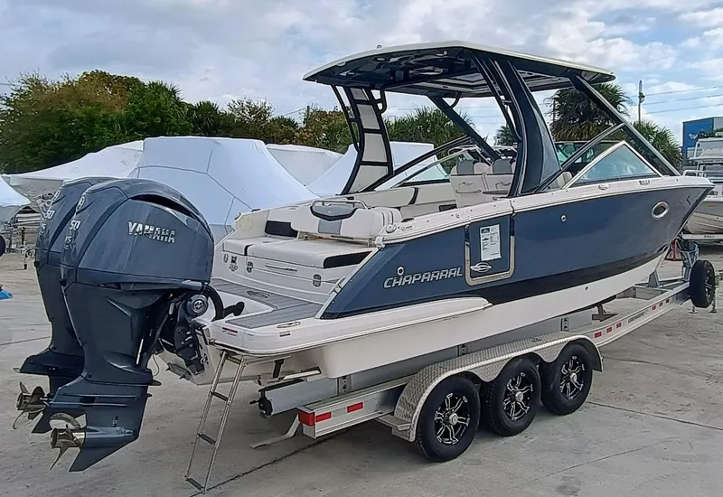Slide: The Image of 2024 Chaparral 280 OSX boat on trailer with dual Yamaha outboard engines. - 4