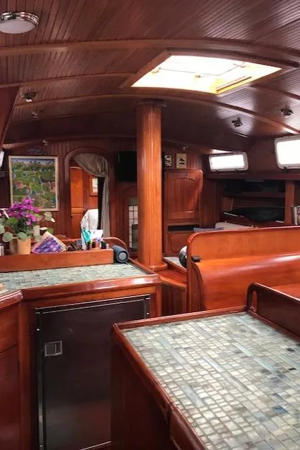 Slide: The Image of Interior of 1983 Stuart Marine 62 Custom Ketch with wood paneling and tiled countertops. - 12