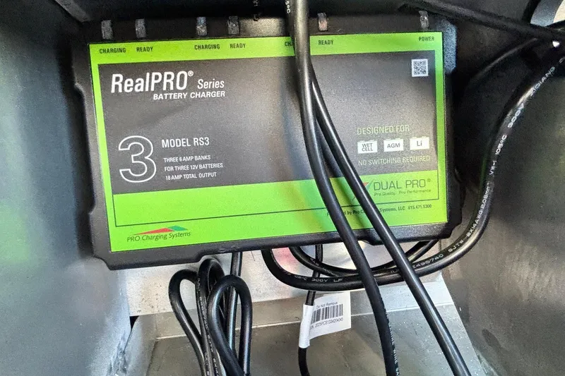 Slide: The Image of RealPRO Series RS3 battery charger in Ranger RT178, 2026 model, with cables connected. - 14