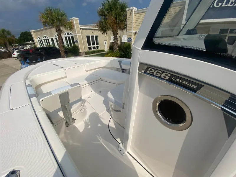 Slide: The Image of 2024 Robalo 266 Cayman boat interior with seating and console. - 19
