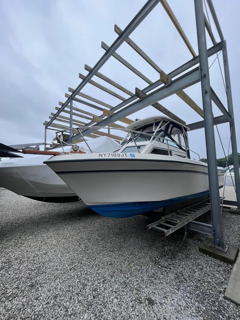 The Image of 1987 Grady-White 24 Offshore boat on dry dock, side view. - 0