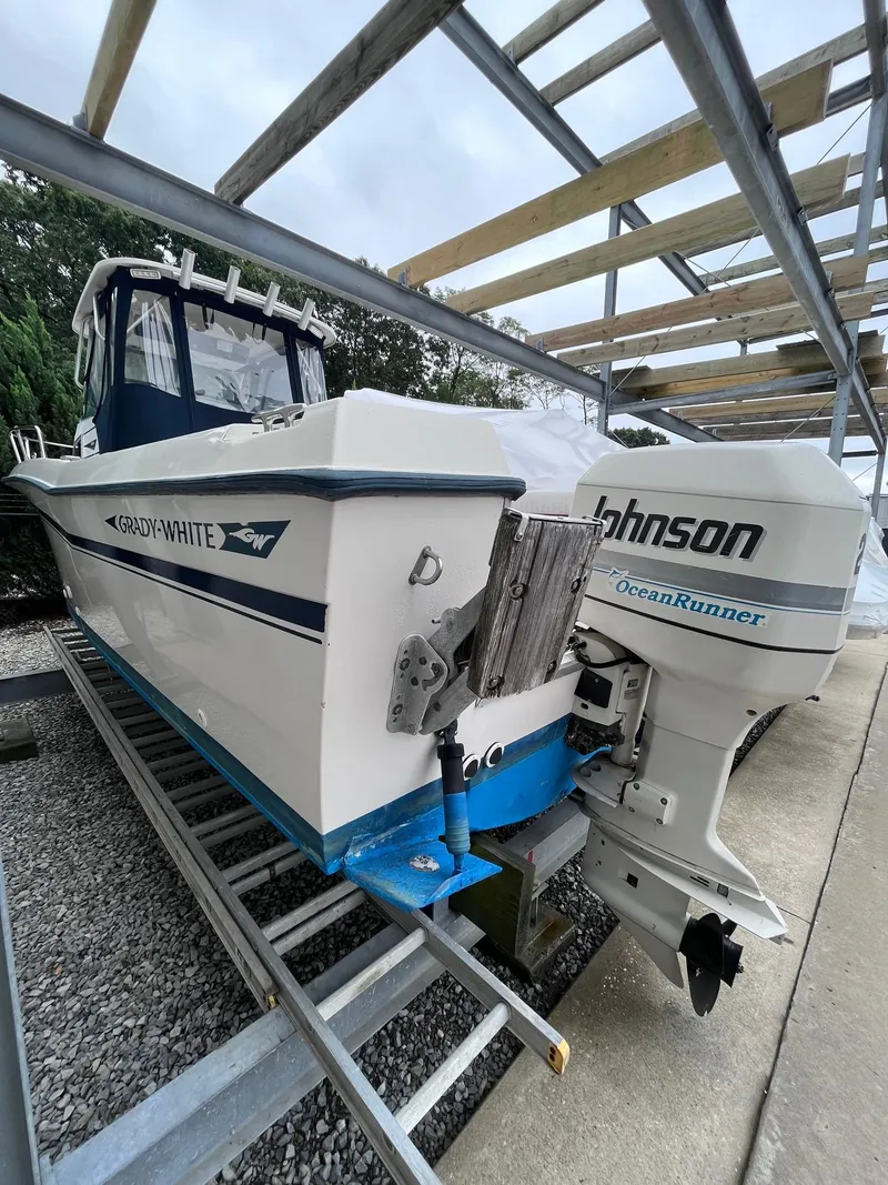 Slide: The Image of 1987 Grady-White 24 Offshore boat with Johnson OceanRunner engine in storage. - 12