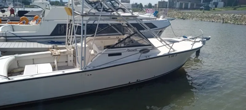 Slide: The Image of 1994 Albemarle 27sf boat docked in a marina. - 14