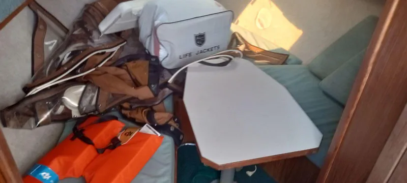 Slide: The Image of Interior of a 1994 Albemarle 27sf boat with life jackets and gear. - 19