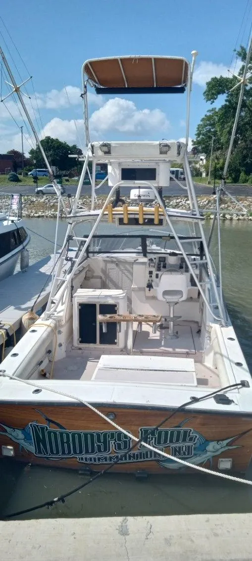 Slide: The Image of 1994 Albemarle 27sf boat docked at a marina. - 2