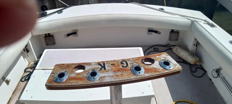 Slide: The Image of 1994 Albemarle 27sf boat interior with rod holders and seating area. - 20