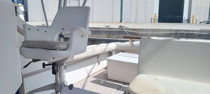 Slide: The Image of 1994 Albemarle 27sf boat interior with seating and storage compartments. - 23