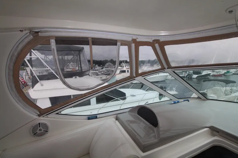 Slide: The Image of Interior view of 2004 Cruisers Yachts 405 Express Motoryacht with marina in background. - 12