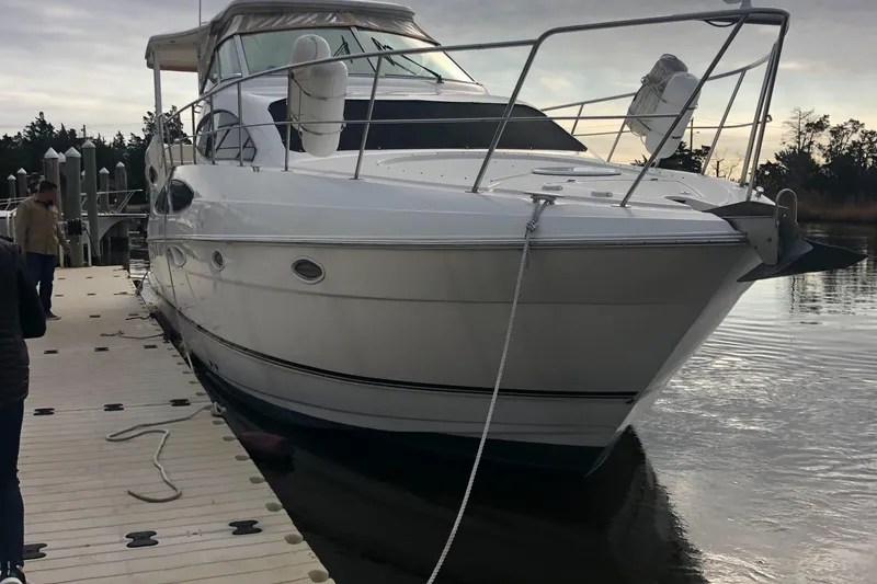 Slide: The Image of 2004 Cruisers Yachts 405 Express Motoryacht docked at marina, side view. - 2