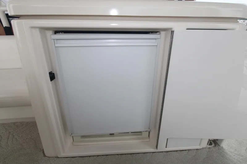 Slide: The Image of 2004 Cruisers Yachts 405 Express Motoryacht interior cabinet with closed door. - 22