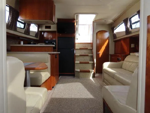 Slide: The Image of Luxurious interior of 2004 Cruisers Yachts 405 Express Motoryacht with elegant seating and wood finishes. - 27