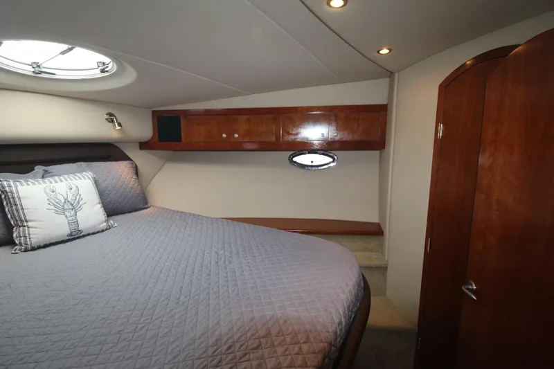 Slide: The Image of Luxurious bedroom in 2004 Cruisers Yachts 405 Express Motoryacht with elegant wood finishes. - 36